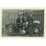 1936. Germany. Young lady with motorbike. The creator of the picture and the person on it are unknown. Black and white original paper image, old photo. (2792504)