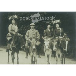   1930s. Germany. Elegant company, on the back of a donkey. The creator of the picture and the identity of the people on it are unknown. Original paper image, old postcard, photo sheet. (2792505)