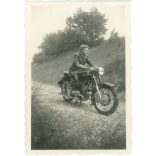 1953. Germany. Young lady with motorbike. The creator of the picture and the person on it are unknown. Black and white original paper image, old photo. (2792507)