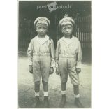 1922. Germany. Sad twins. The creator of the picture and the identity of the people on it are unknown. Black and white original paper image, old photo. (2792529)