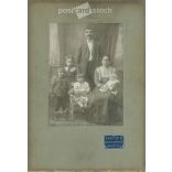 Early 1900s. A full-length studio shot of a married couple and their five children. Made by K. Kerpit’s photography studio, Mezőtúr. Old photo, original cabinet photo / hardback photo. (2792556)