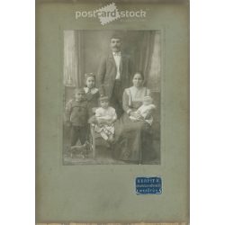   Early 1900s. A full-length studio shot of a married couple and their five children. Made by K. Kerpit’s photography studio, Mezőtúr. Old photo, original cabinet photo / hardback photo. (2792556)