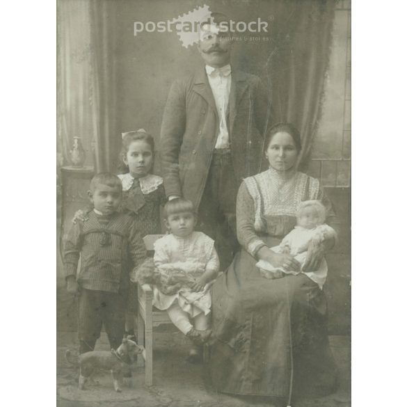 Early 1900s. A full-length studio shot of a married couple and their five children. Made by K. Kerpit’s photography studio, Mezőtúr. Old photo, original cabinet photo / hardback photo. (2792556)