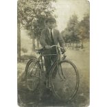 1920s. Young man with bicycle. Original paper image. Old photo. Black and white photo sheet, postcard. (2792562)