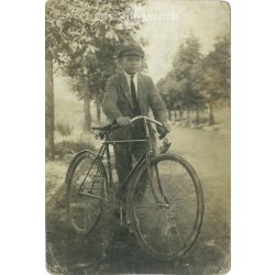   1920s. Young man with bicycle. Original paper image. Old photo. Black and white photo sheet, postcard. (2792562)