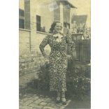 1930s. In a floral dress. The creator of the picture and the person on it are unknown. Original paper image. Old photo. Black and white photo sheet, old postcard. (2792595)