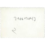 1930s. Biker with a puppy. The creator of the picture and the person on it are unknown. Original paper image. Old photo. (2792656)