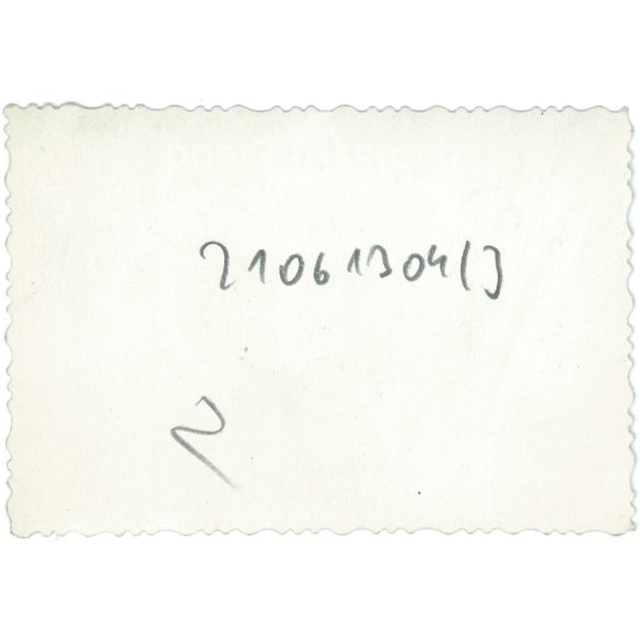 1930s. Biker with a puppy. The creator of the picture and the person on it are unknown. Original paper image. Old photo. (2792656)