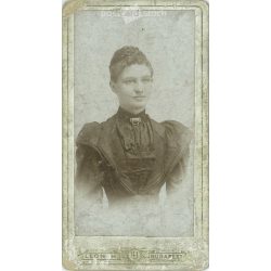   1910s. Studio photo of young woman. The person in the picture is unknown. The work of Leon H. photography studio. Budapest. Old photo, business card, CDV photo. (2792702)