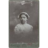 1900. Studio photo of a young woman in elegant clothes. The person in the picture is unknown. The work of the photography studio of Károly Divald’s son. Strawberry. Old photo, business card, CDV photo. (2792705)