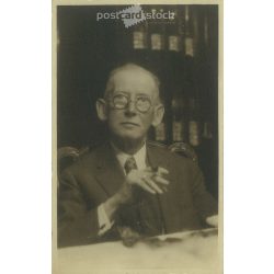   Circa 1920. Unknown English gentleman with a cigar. Original paper image. Old photo. Black and white photo sheet, old postcard. (27925714)