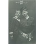 Circa 1910. Mother and son, studio shot. The identity of the people in the picture and the creator of the picture are unknown. Original paper image. Old photo. Black and white photo sheet, old postcard. (2792762)
