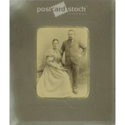   Late 1800s. Studio photo of a middle-aged couple. The identity of the people in the picture and the creator of the picture are unknown. Old photo, original cabinet photo / hardback photo. (2792773)