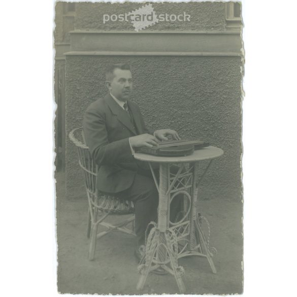 Man with a dulcimer. The person in the picture and the photographer are unknown. Original old photo. Black and white photo album, old postcard. (2792806)