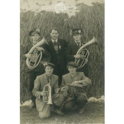  1957 - Cheerful group in front of the haystack. The people in the picture and the photographer are unknown. Old photo. Black and white photo, original paper image. (2792792)