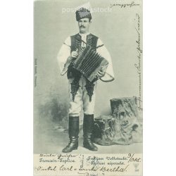   1901 - Man in national costume, with accordion. The person in the picture is unknown. The photo was taken in Tremcsén Teplice, in Henrik Szold’s photo studio. Original old photo. Black and white photo, old postcard. (2792810)