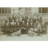 Class photo with cap. The people in the photo and the photographer are unknown. Original old photo. Black and white, laminated photo, original paper photo. (2792812)