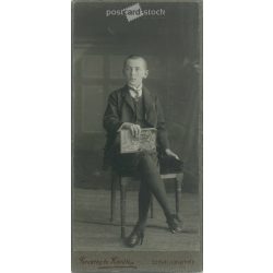   Studio photo of an unknown young boy. The photo was taken in the Ferentzy and Kováts photo studio in Székely-Udvarhely. Old photo / Cabinet photo / hardback photo. (2792984)