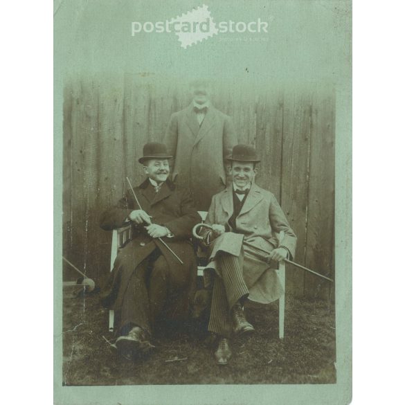 1920s. Cheerful men in hats, with walking sticks. The people in the picture and the photographer are unknown. Original paper image. Black and white photo, original paper image. (2793413)