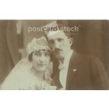 1920s. Studio photo of a young couple. The people in the photo and the photographer are unknown. Original paper photo, black and white photo, postcard. (2793428)