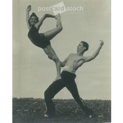   Young artistic couple in balance and harmony with each other. The people in the picture and the creator of the picture are unknown. Black and white photo, original paper print. (2793431)