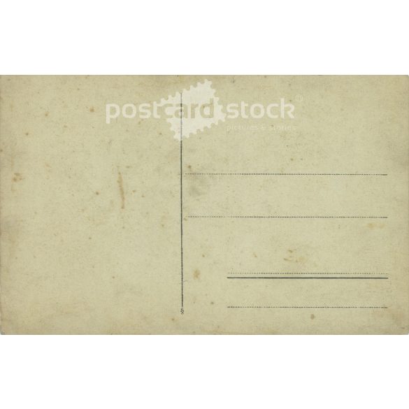 1910s. Little girl with bow and flower. The person in the picture and the photographer are unknown. Original photo. Black and white photo card, postcard. (2793435)