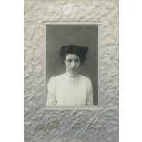 Early 1920s. Young woman in white, with a bow. The picture was taken in the photo studio of Károly Haberfeld. Black and white, laminated old photo, original paper image. (2793608)
