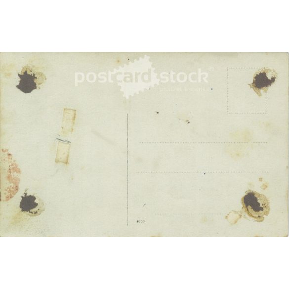 Studio photo of a family of four. The people in the photo and the photographer are unknown. Gelatin silver. Original old photo. Black and white photo card, old postcard. (2793612)