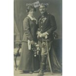 1910s. Studio photo of a young couple. The people in the photo and the photographer are unknown. Original old photo. Black and white photo, old postcard. (2793614)