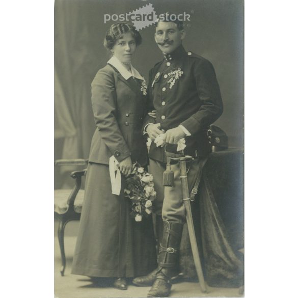 1910s. Studio photo of a young couple. The people in the photo and the photographer are unknown. Original old photo. Black and white photo, old postcard. (2793614)