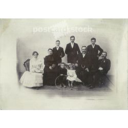   Family group photo, studio shot. The people in the photo and the photographer are unknown. Black and white, large, laminated old photo, original paper photo. (2793632)