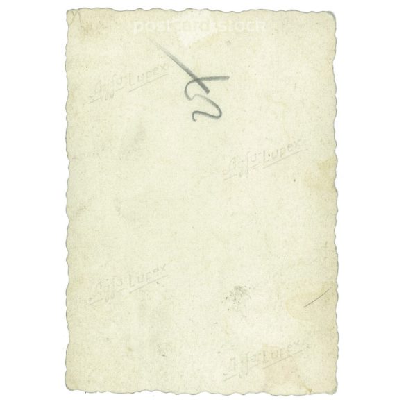 Around a table. The people in the picture and the photographer are unknown. Old photo. Black and white photo, original paper image. (2793635)