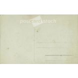 Young woman in white, studio shot. Gelatin silver. The person in the picture and the photographer are unknown. Original old photo. Black and white photo card, old postcard. (2793641)