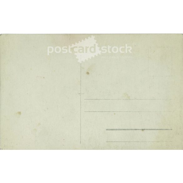 Young woman in white, studio shot. Gelatin silver. The person in the picture and the photographer are unknown. Original old photo. Black and white photo card, old postcard. (2793641)