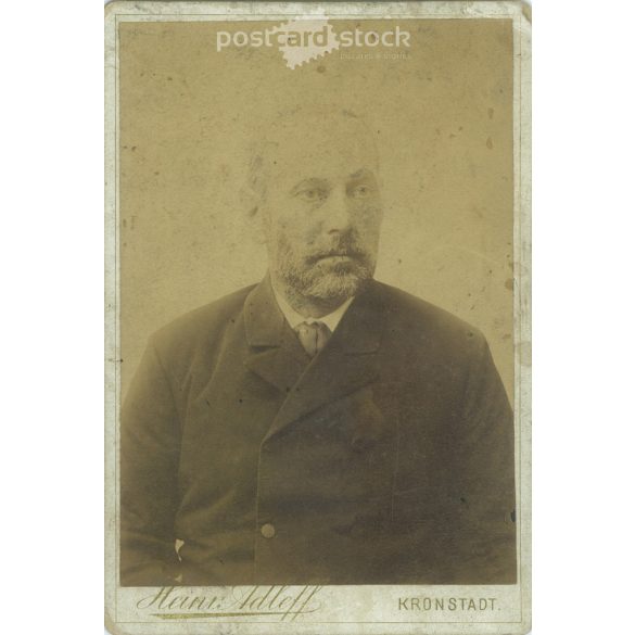 Late 1800s. Studio portrait of a man. The photo was taken in Heinrich Adleff’s studio in Brașov. The person in the photo is unknown. Old photo. Original cabinet photo / hardback photo / business card, CDV photo. (2793642)