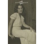 1968 - Young woman in white, studio shot. The person in the photo and the photographer are unknown. Original old photo. Black and white, laminated photo, original paper image. (2793645)