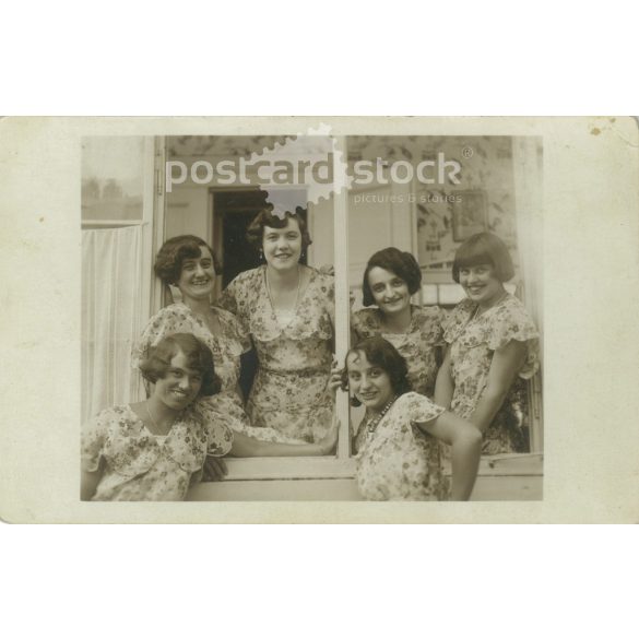 Girls in identical clothes. The people in the picture and the photographer are unknown. Original old photo. Black and white photo album, old postcard. (2793670)