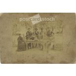 Late 1800s. Family group photo in the garden. The people in the photo and the photographer are unknown. Original old photo. Black and white, laminated photo, original paper photo. (2793672)