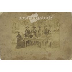   Late 1800s. Family group photo in the garden. The people in the photo and the photographer are unknown. Original old photo. Black and white, laminated photo, original paper photo. (2793672)