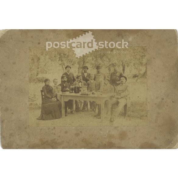 Late 1800s. Family group photo in the garden. The people in the photo and the photographer are unknown. Original old photo. Black and white, laminated photo, original paper photo. (2793672)
