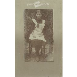   Circa 1910 - Full-length photo of a young girl. The person in the photo and the photographer are unknown. Old photo. Black and white photo sheet, original paper image. (2793759)