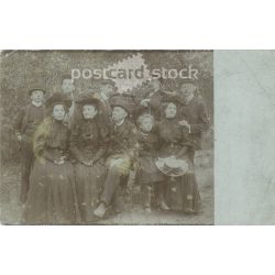   Circa 1900 - Family group photo outdoors. The people in the photo and the photographer are unknown. Old photo. Black and white photo sheet, original paper photo. (2793784)