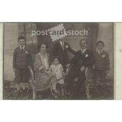   Circa 1928 - Photo of a family of four. The people in the photo and the photographer are unknown. Old photo. Black and white photo sheet, original paper image. (2793786)
