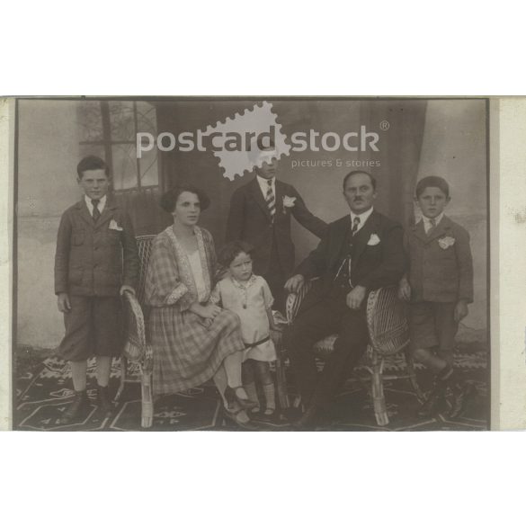 Circa 1928 - Photo of a family of four. The people in the photo and the photographer are unknown. Old photo. Black and white photo sheet, original paper image. (2793786)