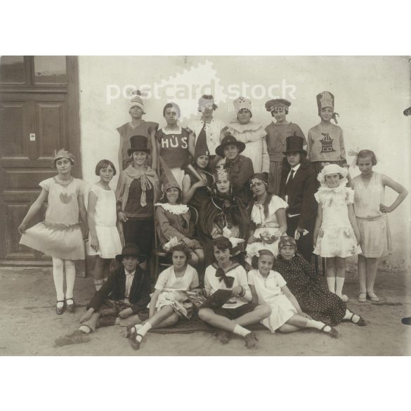 Circa 1930 - Cheerful carnival party. The people in the picture and the photographer are unknown. Original old photo. Black and white photo, original paper image. (2793789)