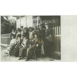  Circa 1915 - Family photo with soldiers. The people in the photo and the photographer are unknown. Old photo. Black and white photo sheet, original paper image. (2793798)
