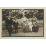 Afternoon in the park. Family photo. The people in the photo and the photographer are unknown. Original old photo. Black and white, laminated photo, original paper photo. (2793850)