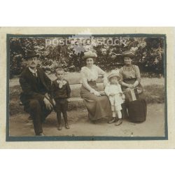   Afternoon in the park. Family photo. The people in the photo and the photographer are unknown. Original old photo. Black and white, laminated photo, original paper photo. (2793850)