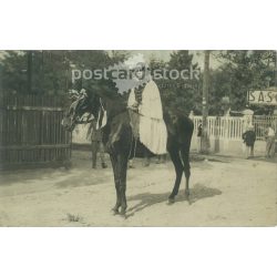   Young man on horseback. Original paper image. Black and white photo, old postcard. (2793858)
