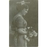 Unknown young lady, in elegant attire. The author of the picture is unknown. Original paper image. Black and white photo, old postcard. (2793859)